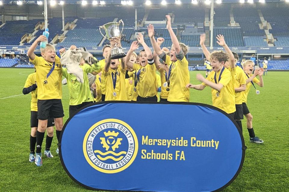 Warrington Schoolboys under 11s lift the trophy at Goodison Park <i>(Image: Contributed)</i>