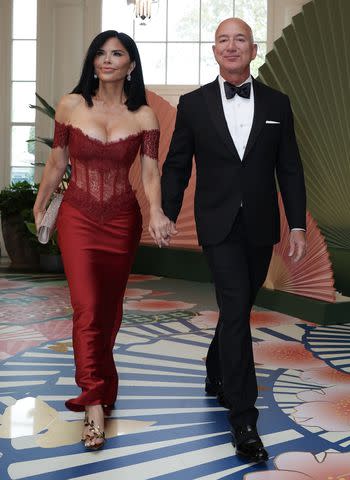 <p>Tasos Katopodis/Getty</p> Lauren Sànchez and Jeff Bezos attend the White House state dinner on April 10, 2024