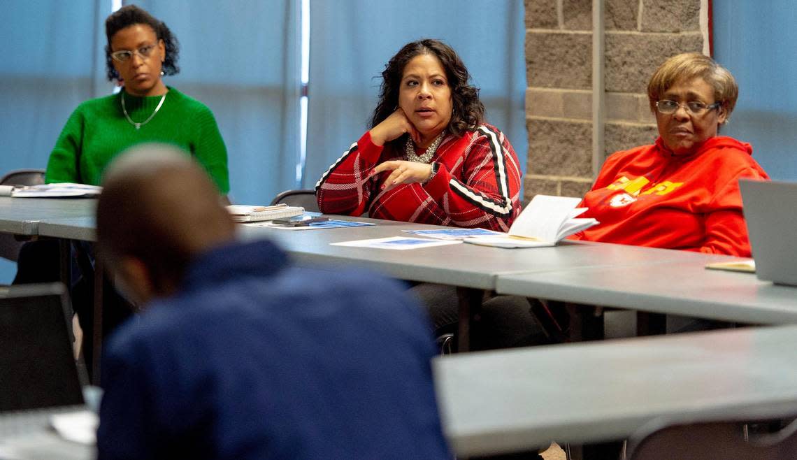Andrea Raya, center, the director of community programs at the Rose Brooks Center, speaks during a Partners for Peace meeting at the Gregg Klice Community Center on Wednesday, Dec. 21, 2022, in Kansas City.