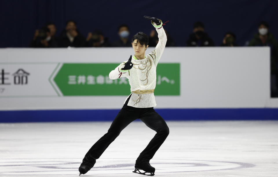 FILE - In this Sunday, Feb. 9, 2020 file photo, Gold medalist Japan's Yuzuru Hanyu performs during the men's single free skating competition in the ISU Four Continents Figure Skating Championships in Seoul, South Korea. As Nathan Chen seeks a third straight World Figure Skating Championships title, something no American has achieved since Scott Hamilton got his fourth in a row in 1984, he has two major challenges in front of him. One is two-time Olympic gold medalist Yuzuru Hanyu of Japan, who Chen calls “the benchmark." The other is idleness in major competitions forced by the coronavirus pandemic. (AP Photo/Lee Jin-man, File)