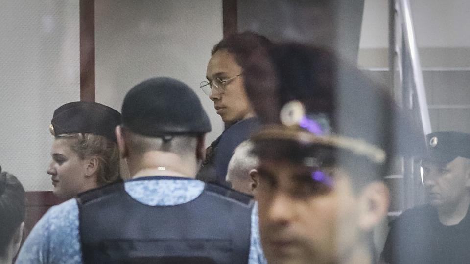 Phoenix Mercury Brittney Griner (C) is escorted to a courtroom for a hearing, in Khimki City Court, outside Moscow, Russia, 14 July 2022.