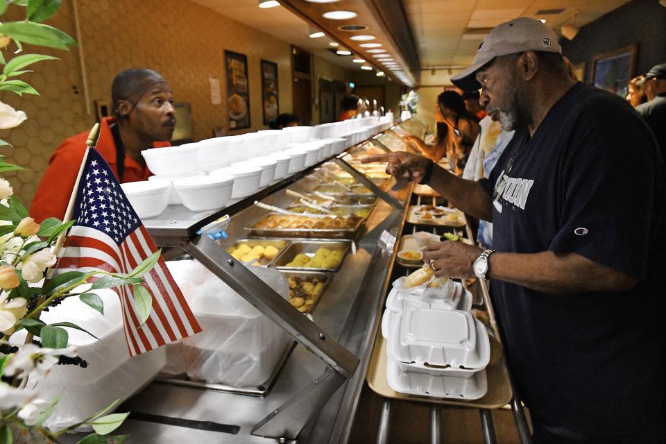 Customer Caleb Powell makes his selections as he gets meals to-go on the food line at Piccadilly Cafeteria on Tuesday, September 26, 2023. "I'm going to miss this place" Powell said.