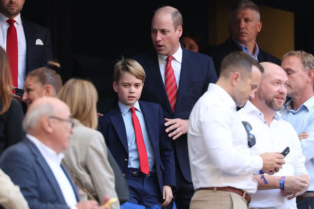 <p>PASCAL GUYOT/AFP via Getty </p> Prince George and Prince William attend the Rugby World Cup on Oct. 14, 2023