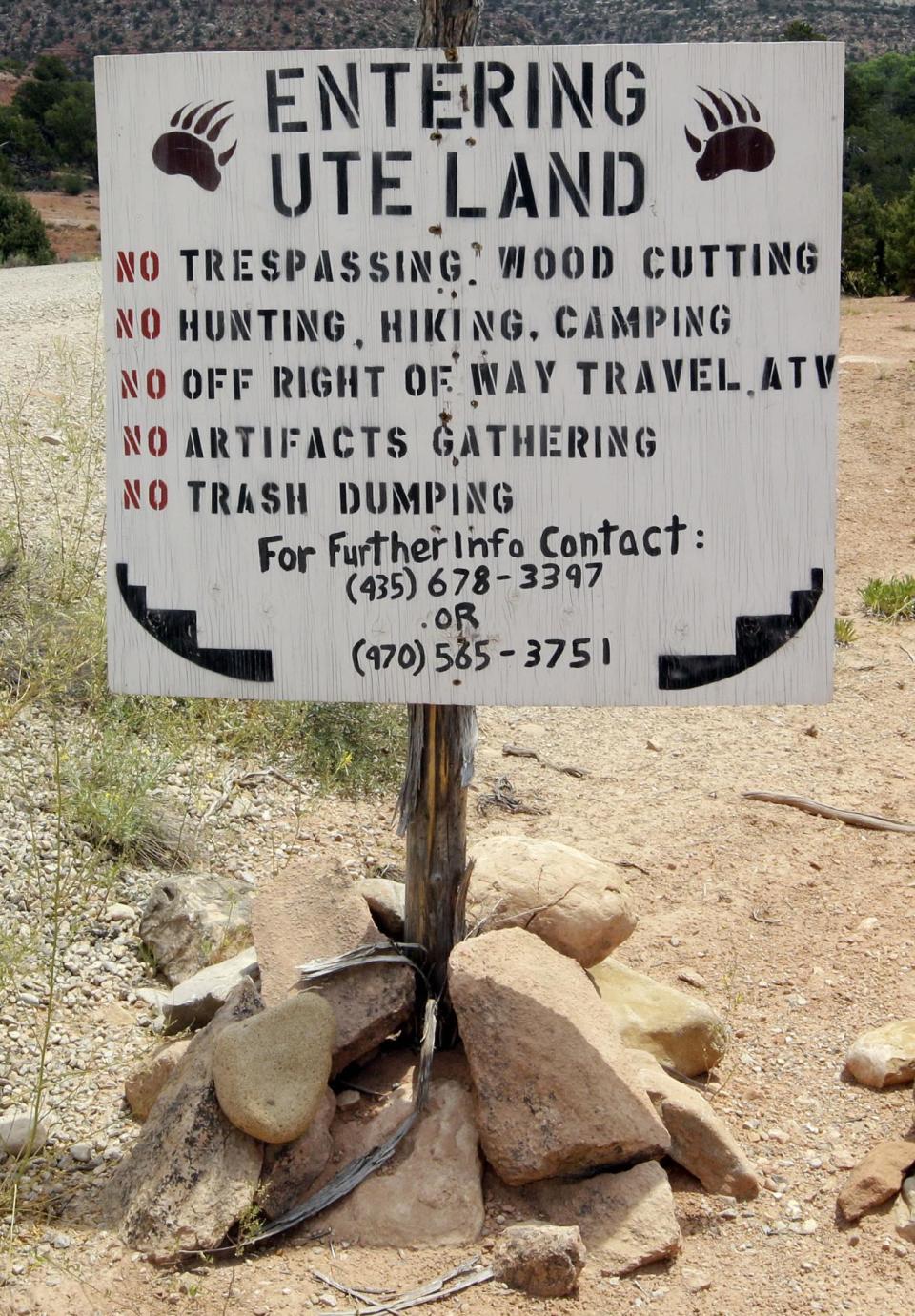 FILE - This June 22, 2016, file photo, a entering "UTE Land" sign is shown, near Blanding, Utah. President Barack Obama on Wednesday, Dec. 28, designated two new national monuments in Utah and Nevada. The Bears Ears National Monument in Utah will cover 1.35 million acres of tribal land in the Four Corners region. (AP Photo/Rick Bowmer, File)