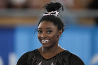 Simone Biles of the United States smiles as she trains for artistic gymnastics at Ariake Gymnastics Centre ahead of the 2020 Summer Olympics, Thursday, July 22, 2021, in Tokyo, Japan. (AP Photo/Ashley Landis)