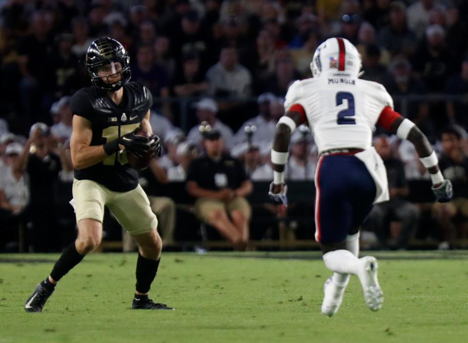 Purdue wide receiver Charlie Jones (15) catches a pass during the team's NCAA college football game against Florida Atlantic, Saturday, Sept. 24, 2022, in West Lafayette, Ind. (Alex Martin/Journal & Courier via AP)