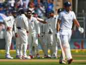 Cricket - India v England - Fourth Test cricket match - Wankhede Stadium, Mumbai, India - 8/12/16. India's players celebrate the wicket of England's Alastair Cook. REUTERS/Danish Siddiqui