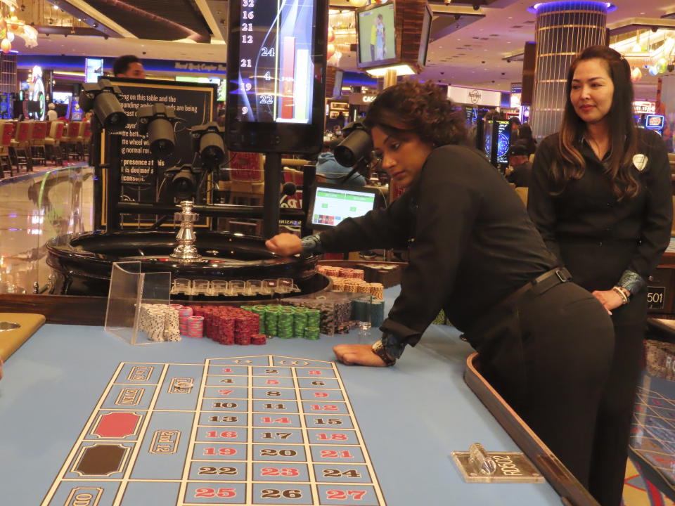 Dealers conduct a game of roulette at the Hard Rock casino in Atlantic City N.J., on May 17, 2023. New Jersey gambling regulators on Monday, June 19, 2023, released figures showing that Atlantic City's casinos, horse tracks and their online partners won nearly $471 million in May, an increase of 9.4% from a year earlier. But the amount of money the casinos won from in-person gamblers declined by 2.4% to $227.3 million. (AP Photo/Wayne Parry)