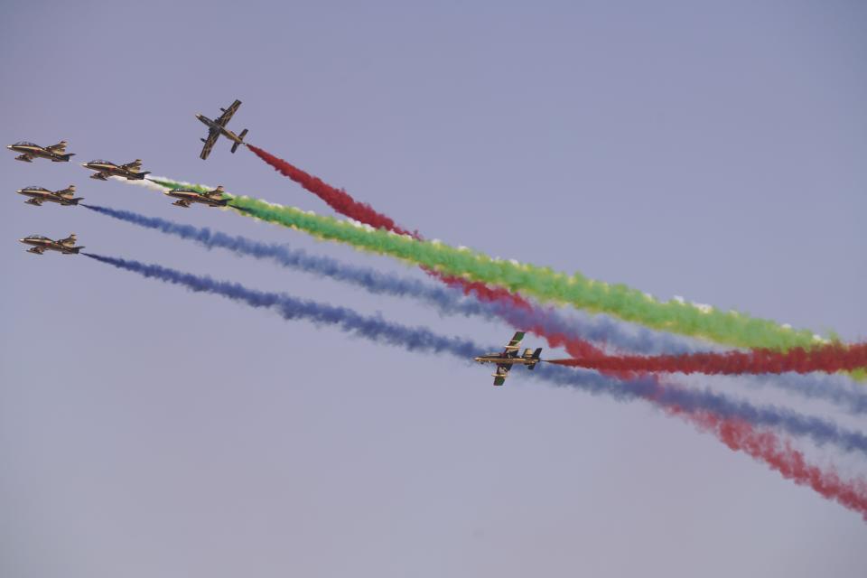 Al Fursan, the United Arab Emirates Air Force's aerobatic team, performs at the Dubai Air Show in Dubai, United Arab Emirates, Wednesday, Nov. 17, 2021. (AP Photo/Jon Gambrell)