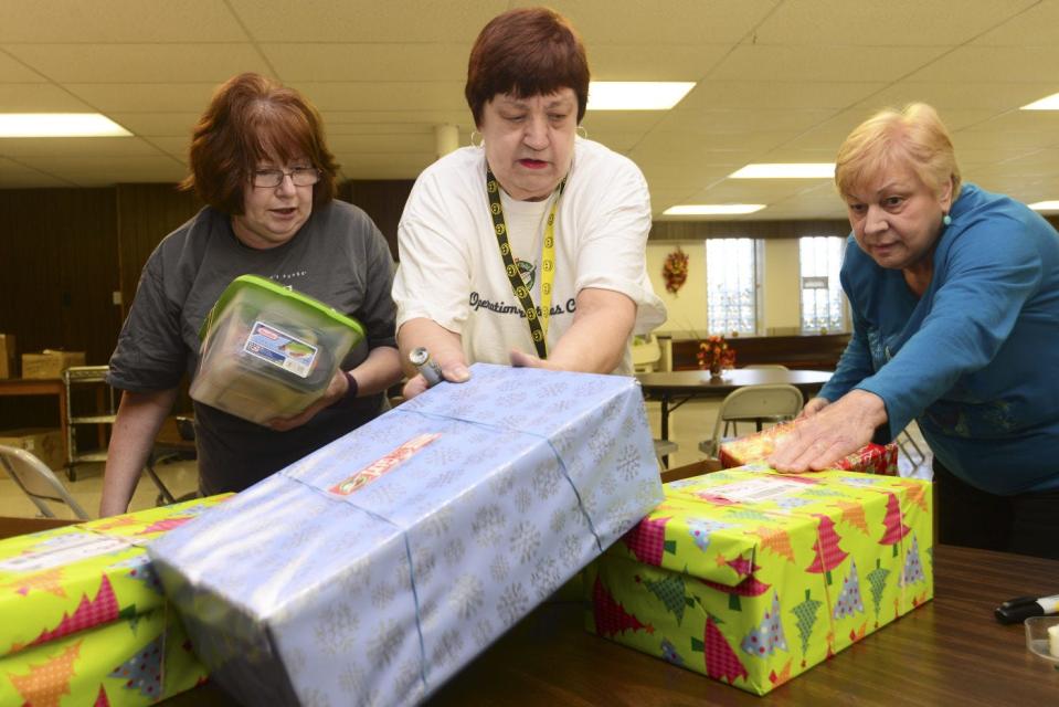 Marcia Smorada of Franklin Township, center, is the drop-off site coordinator for Operation Christmas Child at Calvin Presbyterian Church in Ellwood City. She gets help packing up boxes to ship from volunteers Kathy Brenner, left, of Ellwood City, and Karen Hazen of North Sewickley Township.