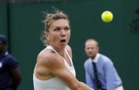 <p>Simona Halep of Romania plays a return to Francesca Sciavone of Italy during their women’s singles match on day four of the Wimbledon Tennis Championships in London, Thursday, June 30, 2016. (AP Photo/Ben Curtis)</p>