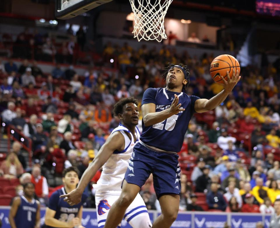 Nevada's Grant Sherfield goes to the basket for a reverse lay-up Thursday against Boise State.