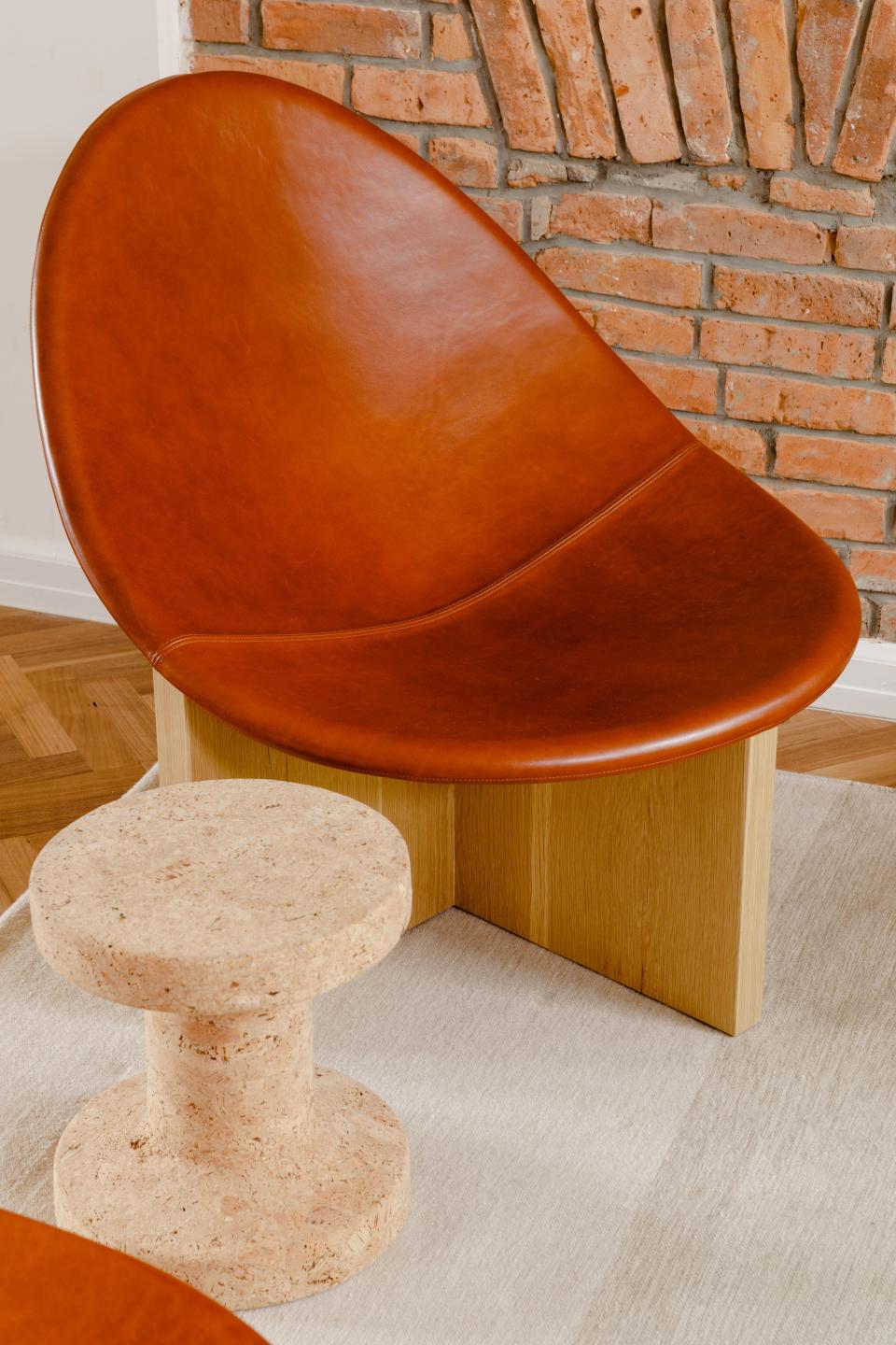 The Estudio Persona Nido Chairs were a splurge. “I really had to convince Chris,” Claire confesses. But their timeless shape and sculptural silhouette made them ideal for the transitional space, where they will be on view at all angles. The cork side tables are from Vitra.