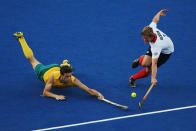 LONDON, ENGLAND - AUGUST 05: Simon Orchard of Australia and Ashley Jackson of Great Britain challenge for the ball during the Men's Hockey match between Australia and Great Britain on Day 9 of the London 2012 Olympic Games at Riverbank Arena Hockey Centre on August 5, 2012 in London, England. (Photo by Daniel Berehulak/Getty Images)