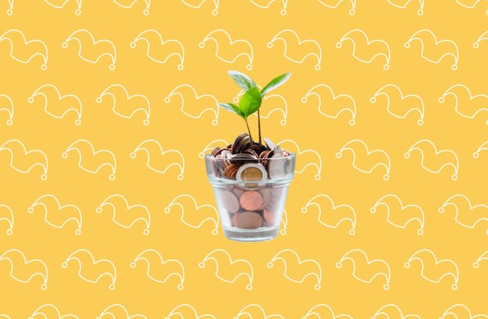 A pot of change with a plant growing out of it