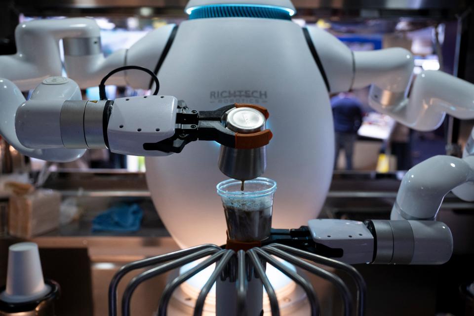 An Adam robot from Richtech Robotics makes coffee at CES 2024.