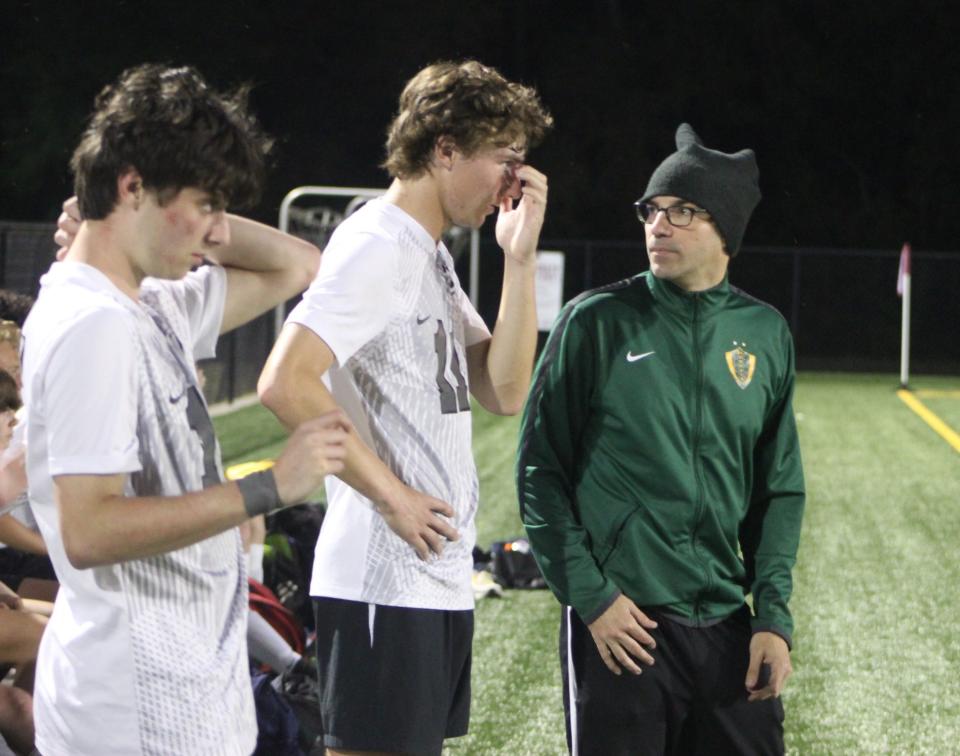 Savannah Country Day soccer coach Michael Hincker talks to a player on the sideline during a win at Benedictine on April 3, 2024.