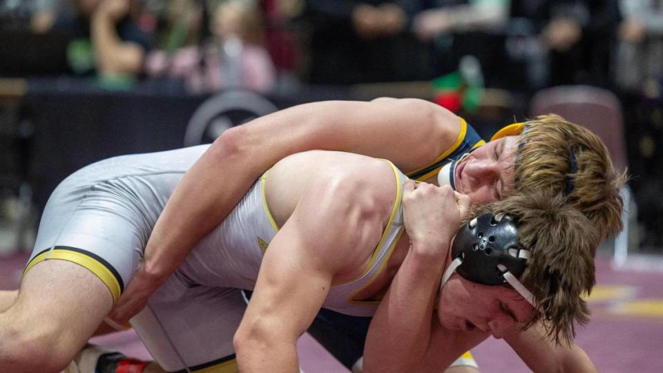 Meridian’s Hudson Rogers competes with Burns’ Easton Kemper in the 182-pound championship at the Rollie Lane Invitational Jan. 6 at the Ford Idaho Center in Nampa. 