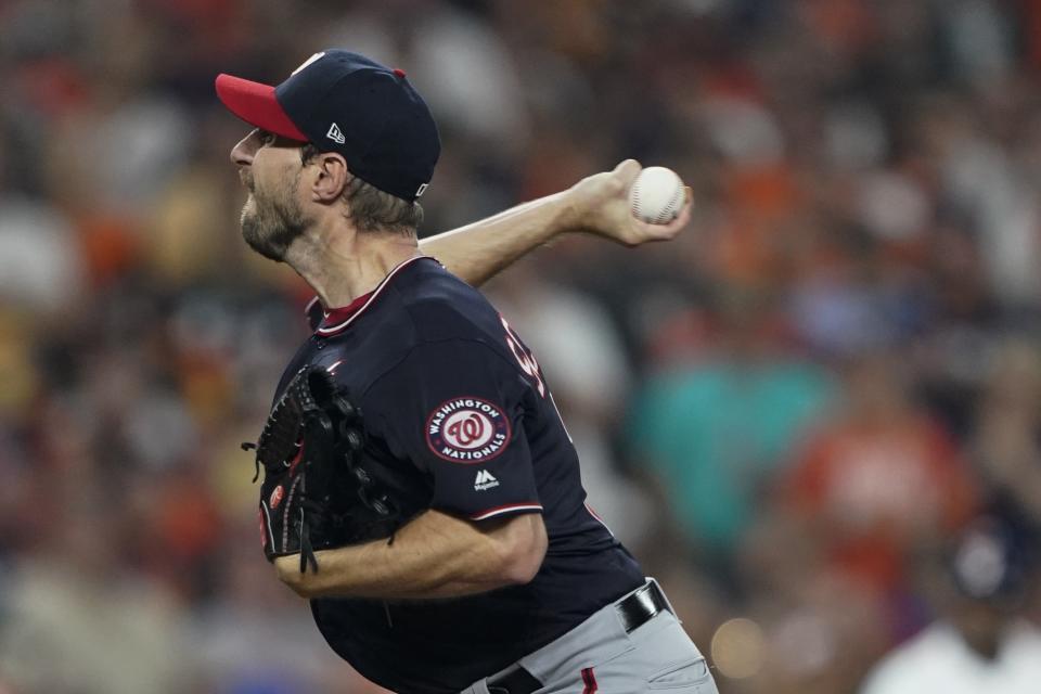 Washington Nationals starting pitcher Max Scherzer the throws during the first inning of Game 1 of the baseball World Series against the Houston Astros Tuesday, Oct. 22, 2019, in Houston. (AP Photo/David J. Phillip)