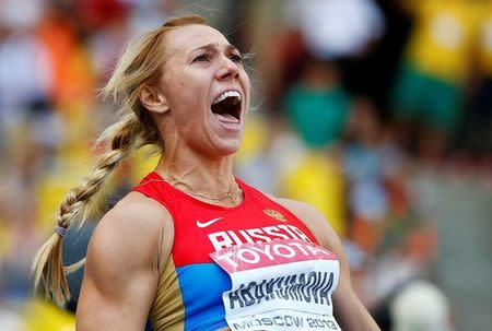 FILE PHOTO - Maria Abakumova of Russia reacts as she competes in the women's javelin throw final during the IAAF World Athletics Championships at the Luzhniki stadium in Moscow August 18, 2013. REUTERS/Dominic Ebenbichler/File Photo