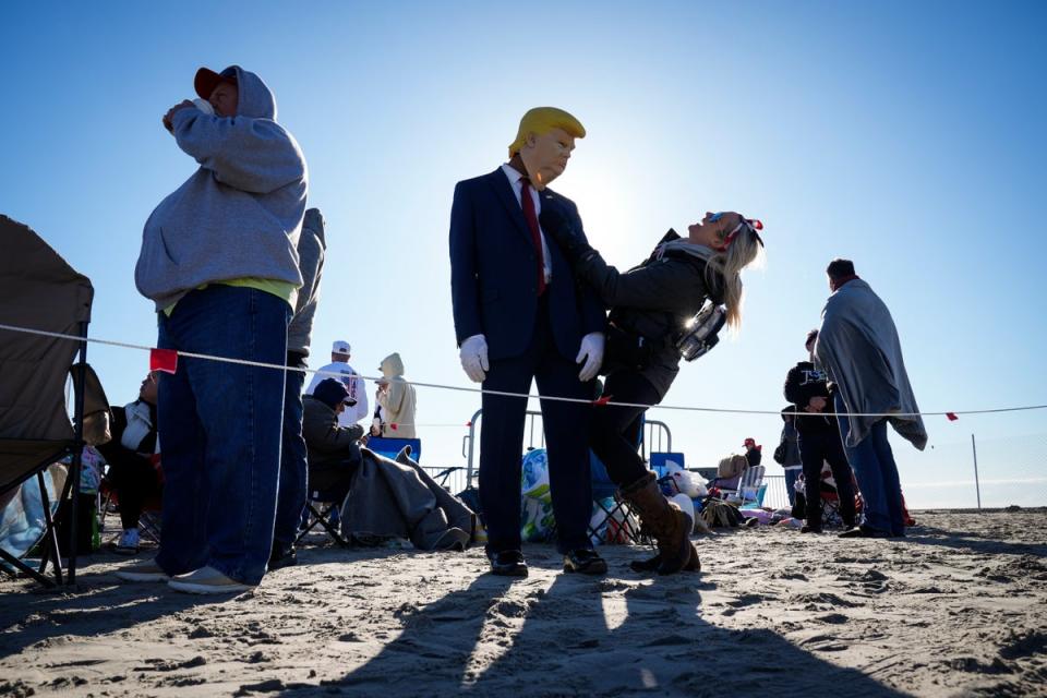 Some fans even donned Trump costumes and American flag-themed outfits for the rally (AP)