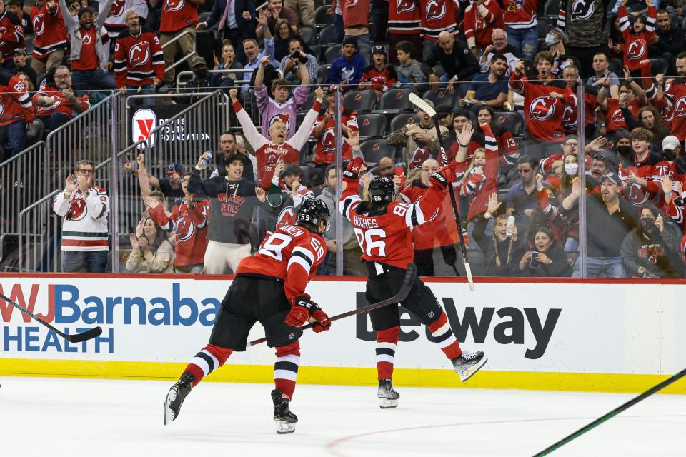 New Jersey Devils center Jack Hughes (86) celebrates his goal with center Janne Kuokkanen (59)  during the second period against the Chicago Blackhawks at Prudential Center.