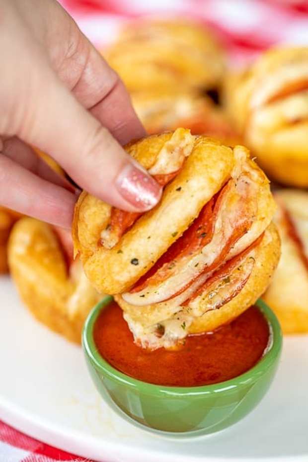 <p>Plain Chicken</p><p>Keep an extra can of biscuits in the fridge for when the kids are craving a pizza-inspired snack.</p><p><strong>Get the recipe: <a href="https://www.plainchicken.com/hasselback-pizza-biscuits/" rel="nofollow noopener" target="_blank" data-ylk="slk:Hasselback Pizza Biscuits;elm:context_link;itc:0;sec:content-canvas" class="link ">Hasselback Pizza Biscuits</a></strong></p>