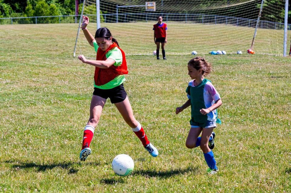 Lanie Kazen clears the ball at the MATTREC Girls Soccer Clinic hosted by Meg Hughes.