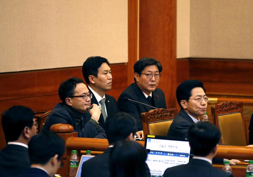 Lawyers for the parliament impeachment committee attend the first hearing arguments for South Korean President Park Geun-hye's impeachment trial at the Constitutional Court in Seoul, South Korea, Tuesday, Jan 3, 2017. (Kim Hong-Ji/Pool Photo via AP)