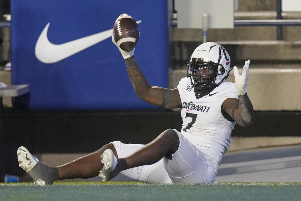 Cincinnati tight end Chamon Metayer (7) celebrates after scoring against BYU during the second half of an NCAA college football game Friday, Sept. 29, 2023, in Provo, Utah. (AP Photo/Rick Bowmer)