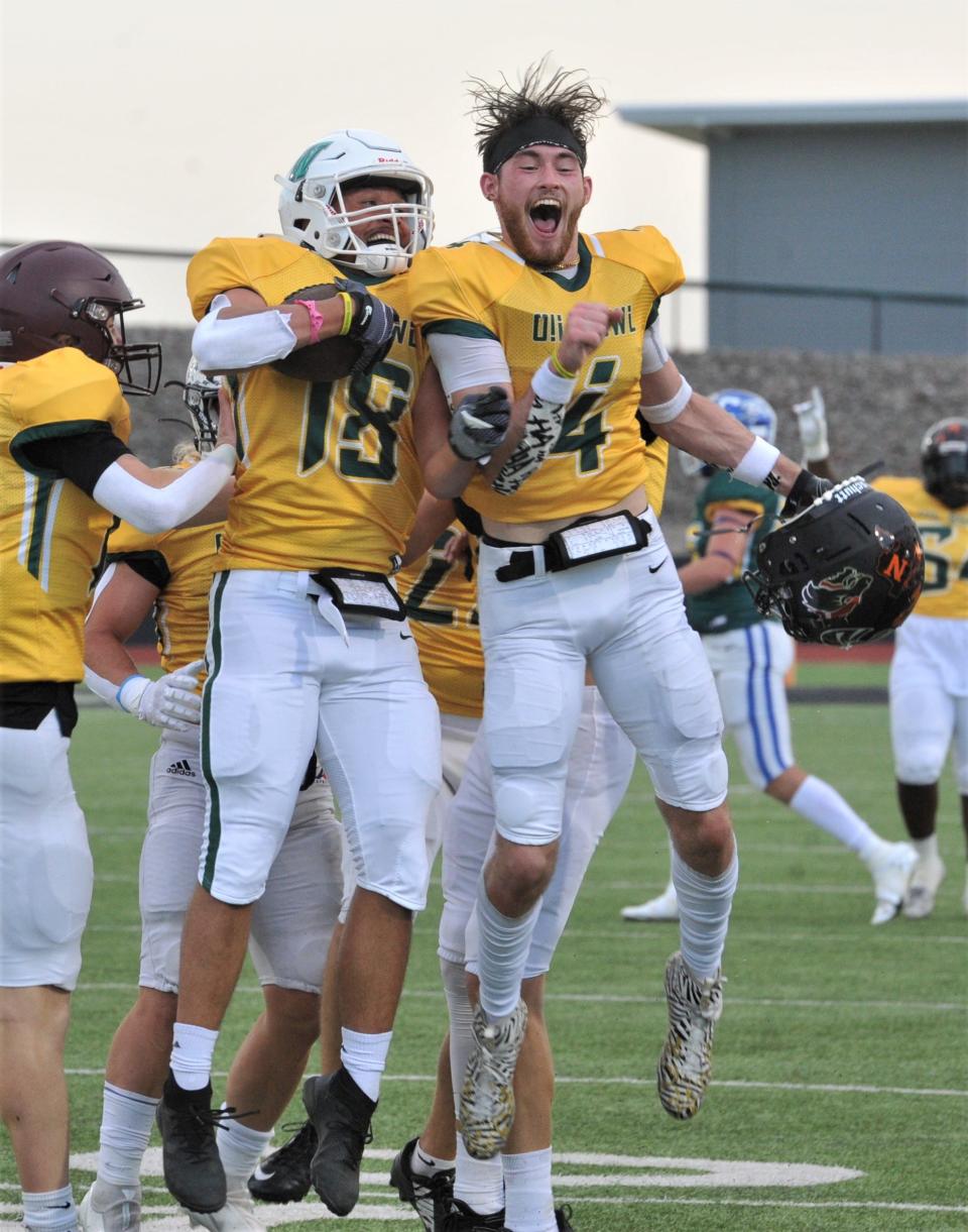 Lake Worth's Nathaniel Session Jr. (left) celebrates with Henrietta's Braden Bell during the 2022 Maskat Shrine Oil Bowl Football game at Iowa Park on Saturday, June 18, 2022.