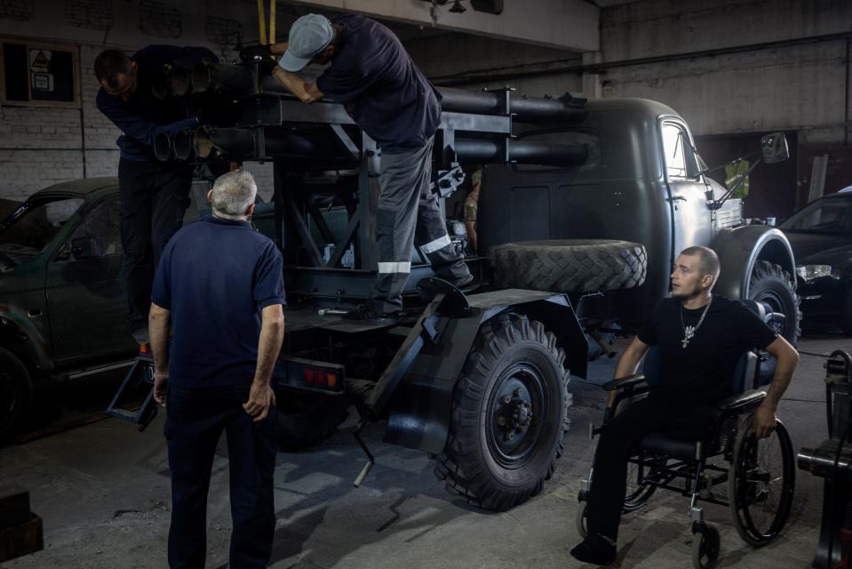 Ukrainian civilian volunteers work to modify damaged and salvaged vehicles into small mobile MLRS (Multiple Launch Rocket System) units made from recovered Russian and Ukrainian military hardware on September 25, 2023, in Zaporizhzhia, Ukraine.