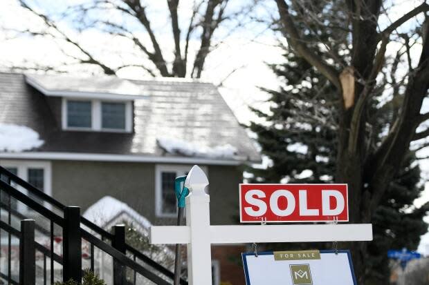 A sign outside a home indicating that it has been sold in early March 2021. (Justin Tang/Canadian Press - image credit)