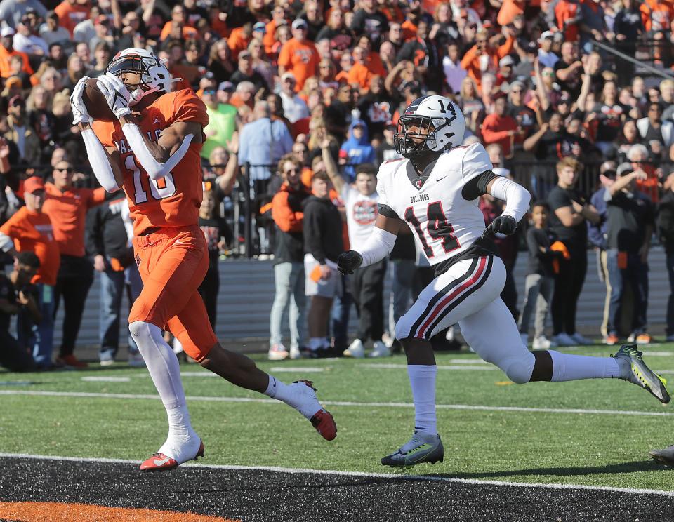 Massillon's Ardell Banks scores a first-quarter touchdown as McKinley's DJ Lewis defends Saturday, October 22, 2022.
