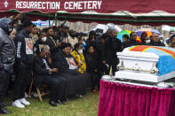 Family and friends of Patrick Lyoya mourn during the burial service for Lyoya at Resurrection Cemetery in Wyoming, Mich. on Friday, April 22, 2022. Lyoya, 26, a Black man was killed April 4, 2022 by a white Grand Rapids, Mich. police officer. (Joel Bissell/Kalamazoo Gazette via AP)