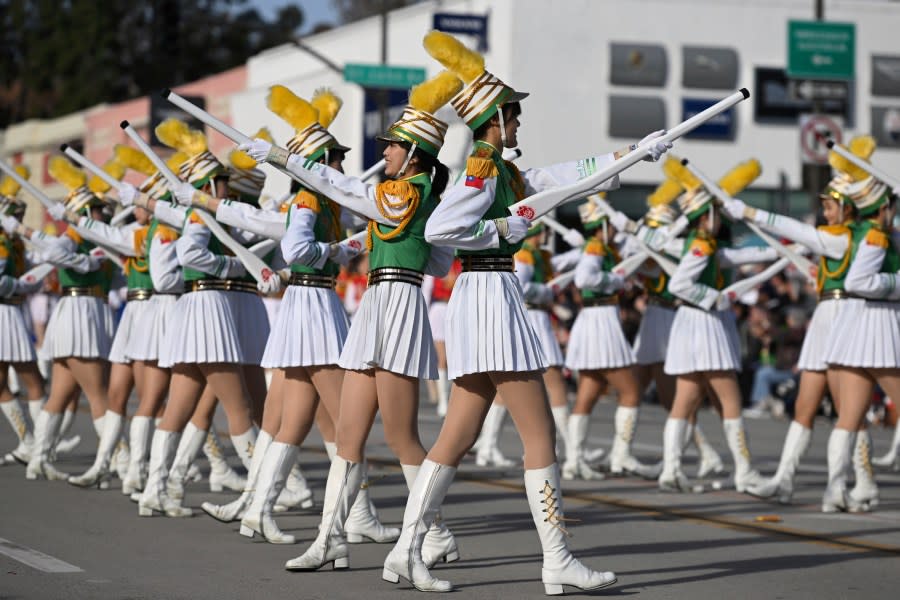 The Taipei First Girls High School Marching Band, Honor Guard and Color Guard perform at the 134th Rose Parade in Pasadena, Calif., Monday, Jan. 2, 2023. (AP Photo/Michael Owen Baker)