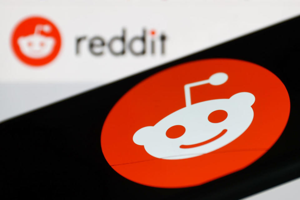 Reddit logo displayed on a phone screen and Reddit website logo displayed on a screen in the background are seen in this illustration photo taken in Krakow, Poland on November 5, 2022. (Photo by Jakub Porzycki/NurPhoto via Getty Images)