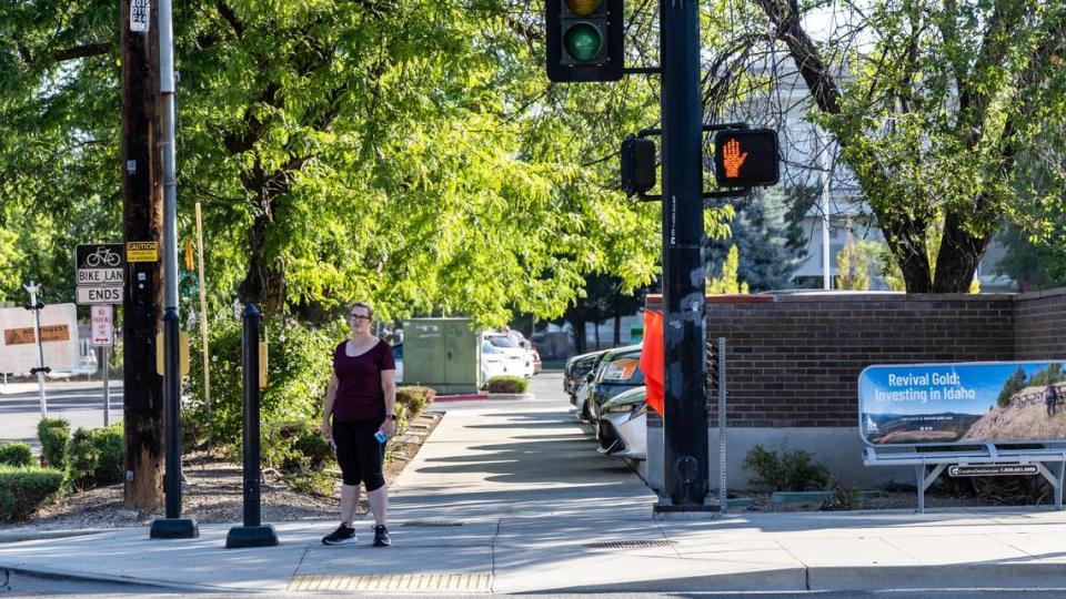 The timing of walk lights and stop lights has been adjusted so pedestrians can begin crossing while all lanes are still at a stop at the intersection of 11th and State Street near the Downtown Boise YMCA.