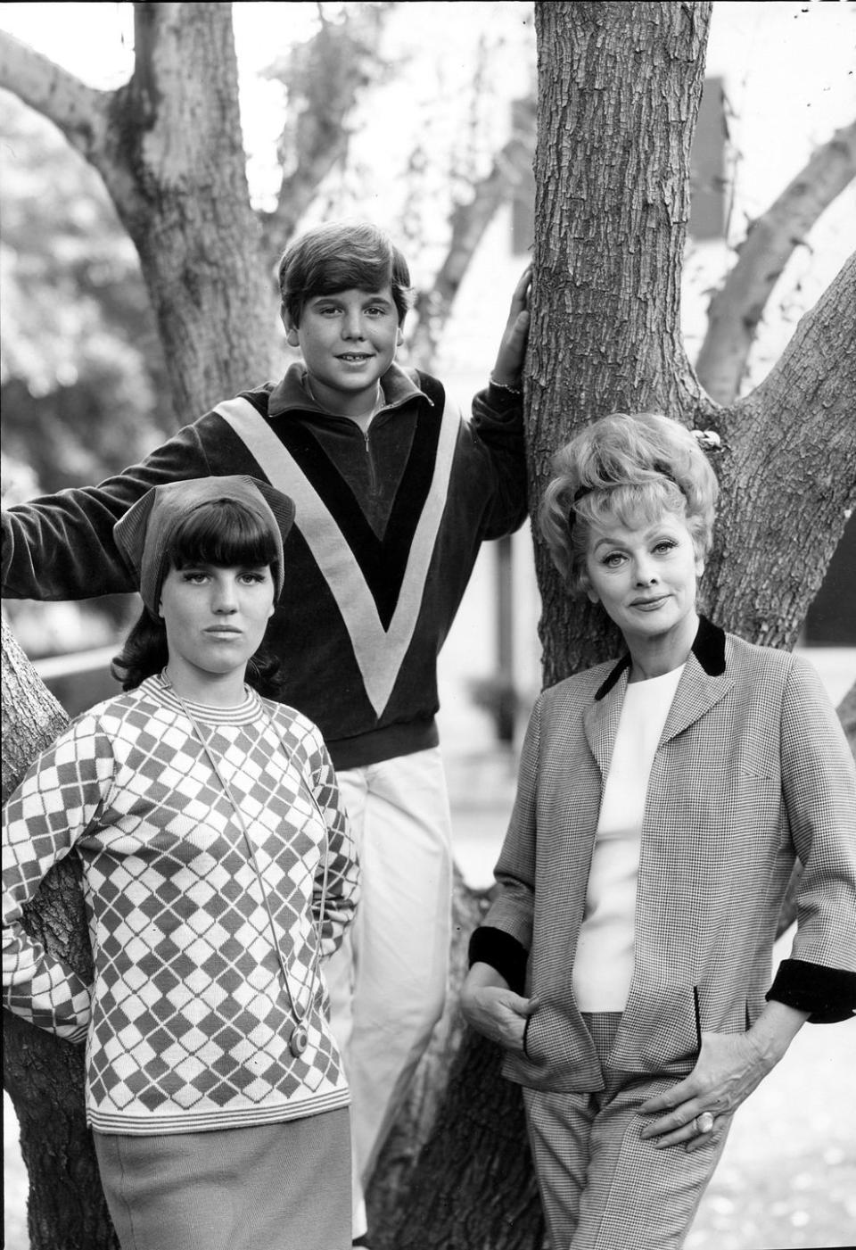 1965: Standing by a tree with her kids Lucie, 14, and Desi, 12.