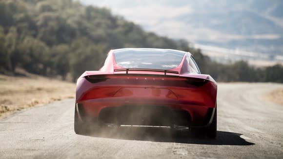 The back of a Tesla Roadster 2.0 while driving.