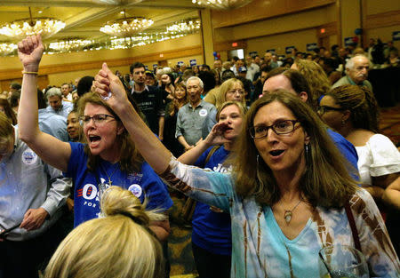 Supporters of Jon Ossoff cheer as speakers rally for Ossoff as the Georgia's Sixth District Congressional candidate Jon Ossoff's Election Night party in Sandy Springs, Georgia, U.S., April 18, 2017. REUTERS/Marvin Gentry
