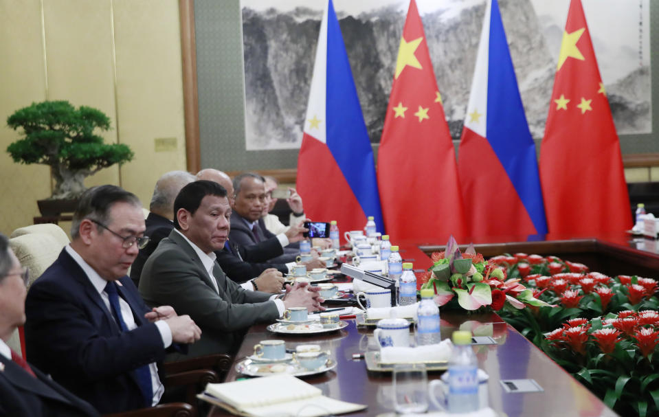 Philippine President Rodrigo Duterte, second from left, speaks to Chinese President Xi Jinping (not pictured) during their meeting at the Diaoyutai State Guesthouse in Beijing, Thursday, Aug. 29, 2019. (How Hwee Young/Pool Photo via AP)
