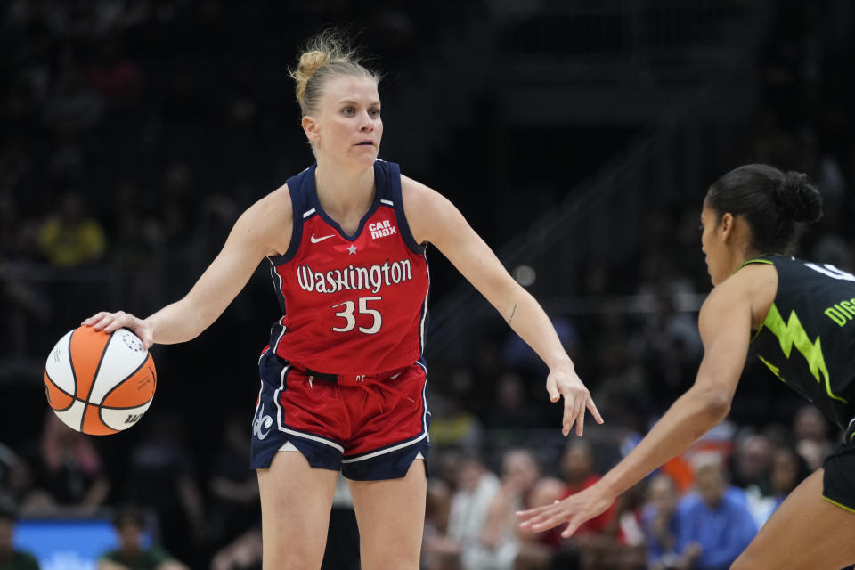 Washington Mystics guard Julie Vanloo moves the ball against Seattle Storm guard Skylar Diggins-Smith during a WNBA basketball game Saturday, May 25, 2024, in Seattle. (AP Photo/Lindsey Wasson)