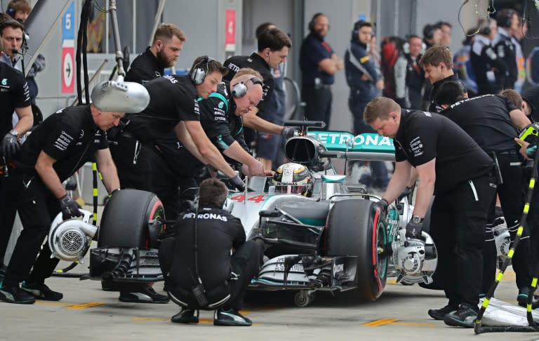 Mechanics work on the Mercedes car of Lewis Hamilton during the qualifying session of the Russian GP on April 30, 2016