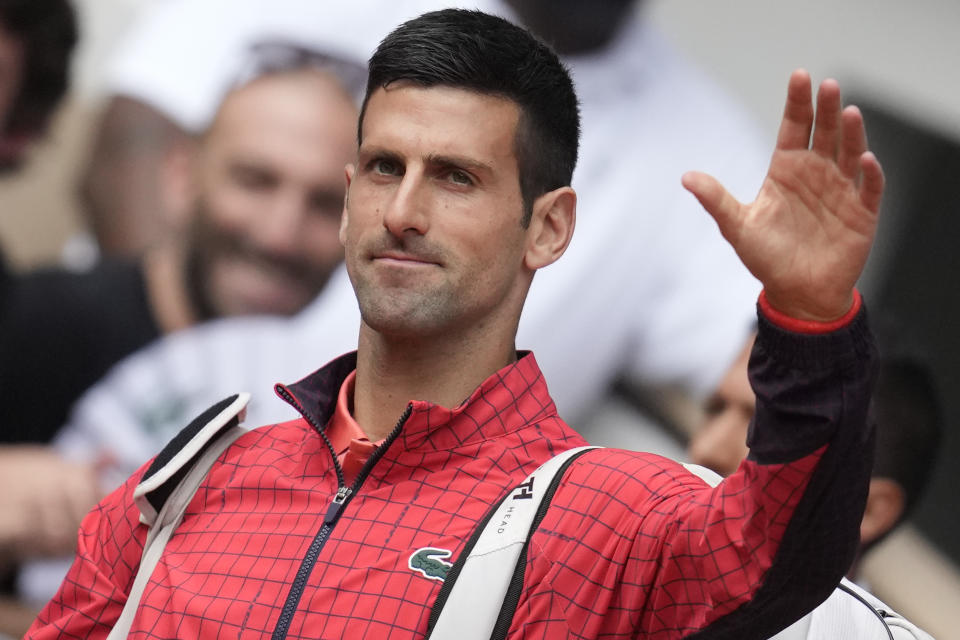 FILE - Serbia's Novak Djokovic enters center court for his men's singles final match of the French Open tennis tournament against Norway's Casper Ruud at the Roland Garros stadium in Paris, Sunday, June 11, 2023. Djokovic is expected to compete at Wimbledon next week. (AP Photo/Christophe Ena)