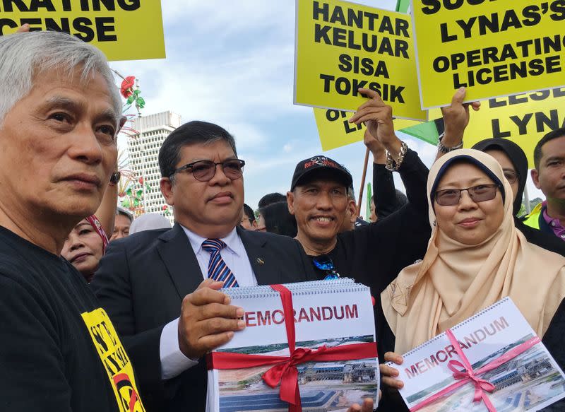 FILE PHOTO: FILE PHOTO: People take part in a protest calling on the government to suspend a rare earths processing plant in the country operated by Australia's Lynas Corp in Kuala Lumpur, Malaysia