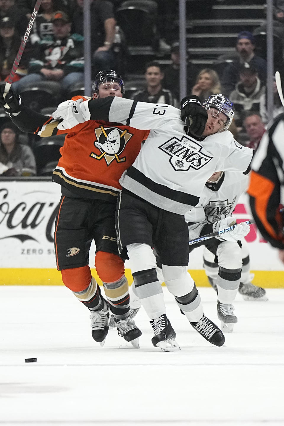 Anaheim Ducks defenseman Simon Benoit, left, and Los Angeles Kings right wing Gabriel Vilardi battle for the puck during the first period of an NHL hockey game Friday, Feb. 17, 2023, in Anaheim, Calif. (AP Photo/Mark J. Terrill)