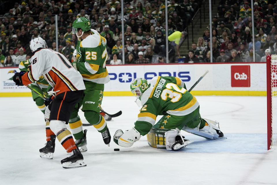 Minnesota Wild goaltender Filip Gustavsson (32) stops the puck during the second period of an NHL hockey game against the Anaheim Ducks, Saturday, Jan. 27, 2024, in St. Paul, Minn. (AP Photo/Abbie Parr)
