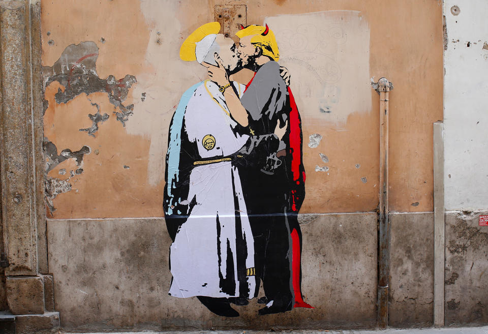 A mural depicting Pope Francis and President Trump kissing