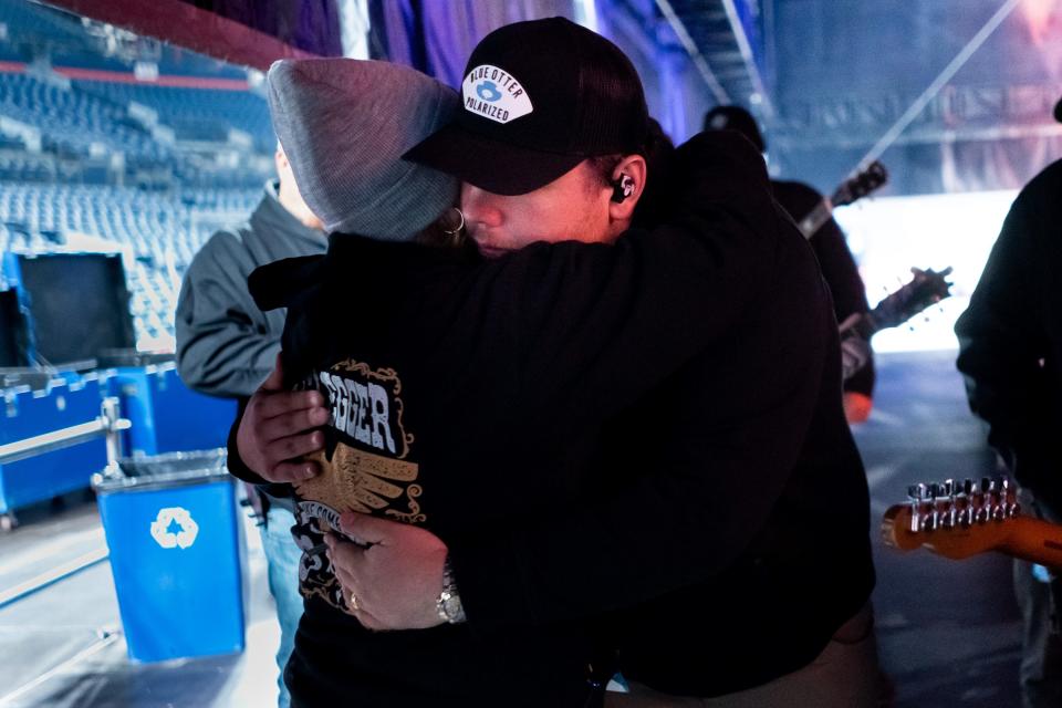 Luke Combs hug his mother, Rhonda Combs, before performing at Empower Field at Mile High in Denver, Colo., Saturday, May 21, 2022. The show kicked off Combs’ first-ever headlining stadium tour.